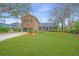 Beautiful brick home on a lush green lot with mature trees and professional landscaping at 750 Lakenheath Dr, Mount Pleasant, SC 29464