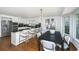 Open kitchen and dining area with granite counters, stainless steel appliances, and a breakfast bar at 750 Lakenheath Dr, Mount Pleasant, SC 29464