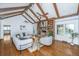 Open living room with hardwood floors, vaulted ceilings, brick fireplace, and comfortable seating at 750 Lakenheath Dr, Mount Pleasant, SC 29464