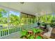 Relaxing screened-in porch with seating area and a view of the surrounding nature at 750 Lakenheath Dr, Mount Pleasant, SC 29464