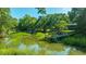 Marsh and dock are framed by lush trees, offering a serene and natural setting at 750 Lakenheath Dr, Mount Pleasant, SC 29464