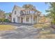 Beautiful two-story home with white siding, wood accents, and a welcoming front porch at 755 Adluh St, Mount Pleasant, SC 29464