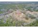 Expansive aerial view of a home nestled within a densely wooded lot at 7560 Cottageville Hwy, Round O, SC 29474