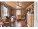 Cozy bedroom with wood-paneled walls, ceiling fan, and lots of natural light at 7560 Cottageville Hwy, Round O, SC 29474