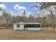Charming home with a green and white exterior and a covered porch at 7560 Cottageville Hwy, Round O, SC 29474