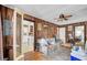 Inviting living room with wood paneling, doorway views, and a ceiling fan at 7560 Cottageville Hwy, Round O, SC 29474