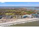 Gorgeous aerial view of beachfront condos with ocean access and nearby golf course at 9000 Palmetto Dr # G203, Isle of Palms, SC 29451