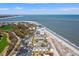 Stunning aerial view of beachfront condos, ocean, and golf course offering luxury coastal living at 9000 Palmetto Dr # G203, Isle of Palms, SC 29451