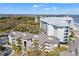 Aerial view of condo complex, showcasing lush greenery and proximity to the beach at 9000 Palmetto Dr # G203, Isle of Palms, SC 29451