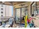 Comfortable balcony with wicker furniture, offering a partial view of the interior and ocean at 9000 Palmetto Dr # G203, Isle of Palms, SC 29451