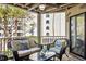 Cozy balcony with wicker furniture, providing a peaceful outdoor retreat at 9000 Palmetto Dr # G203, Isle of Palms, SC 29451