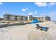 Beachfront condos with beach chairs and umbrella provide a perfect spot to unwind by the ocean at 9000 Palmetto Dr # G203, Isle of Palms, SC 29451