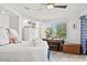 Bright bedroom featuring a white bed, dresser, and a sunlit window with nice views at 9000 Palmetto Dr # G203, Isle of Palms, SC 29451