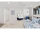 Bright bedroom featuring a daybed with blue accents and a view into the Primary bedroom at 9000 Palmetto Dr # G203, Isle of Palms, SC 29451