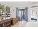 Bedroom featuring a queen bed, desk and access to a private balcony overlooking beautiful outdoor scenery at 9000 Palmetto Dr # G203, Isle of Palms, SC 29451
