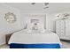 Bright bedroom featuring a queen bed with white linens and tile flooring at 9000 Palmetto Dr # G203, Isle of Palms, SC 29451