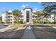 Exterior view of the building showcasing its architectural design and multiple balconies with steps at 9000 Palmetto Dr # G203, Isle of Palms, SC 29451