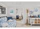 Bright entryway area with coastal decor and a view into the spacious living room at 9000 Palmetto Dr # G203, Isle of Palms, SC 29451