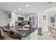 Modern kitchen with stainless steel appliances, sleek countertops, and a breakfast bar for casual dining at 9000 Palmetto Dr # G203, Isle of Palms, SC 29451