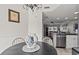 Charming dining area with a view into the kitchen, featuring modern appliances and a cozy atmosphere at 9000 Palmetto Dr # G203, Isle of Palms, SC 29451