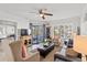 Bright living room showcasing comfortable seating and easy access to the outdoor balcony at 9000 Palmetto Dr # G203, Isle of Palms, SC 29451