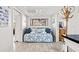 Bright living space featuring a daybed with decorative pillows, a coat rack, and tiled flooring at 9000 Palmetto Dr # G203, Isle of Palms, SC 29451