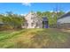 Exterior view of house and screened porch with green backyard at 9116 Fieldstone Trace, Summerville, SC 29485
