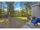 View of large fenced backyard with storage shed and grill area at 9116 Fieldstone Trace, Summerville, SC 29485