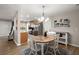 Bright dining area featuring natural light, hardwood floors, and a seamless flow into the adjacent kitchen at 9116 Fieldstone Trace, Summerville, SC 29485