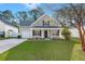 Charming single-Gathering home featuring well-manicured lawn, tidy landscaping, and attached garage on a sunny day at 9116 Fieldstone Trace, Summerville, SC 29485