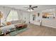 Comfortable living room with hardwood floors, light-colored walls, and an open view to the kitchen at 9116 Fieldstone Trace, Summerville, SC 29485