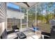 View of screened porch with outdoor furniture, open views of fenced yard at 9116 Fieldstone Trace, Summerville, SC 29485