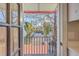Charming view of a tree-lined street from a balcony with a decorative iron railing at 10 Humphrey Ct, Charleston, SC 29403