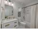 Bright bathroom with white subway tile, a marble countertop, and gold fixtures at 10 Humphrey Ct, Charleston, SC 29403