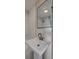 Modern bathroom featuring a pedestal sink and black fixtures at 10 Humphrey Ct, Charleston, SC 29403