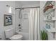 Bright bathroom featuring a shower-tub combo, vanity with decor, and a neutral color scheme at 10 Humphrey Ct, Charleston, SC 29403
