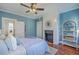 Bedroom featuring a modern fireplace, hardwood floors, and a decorative bookshelf at 10 Humphrey Ct, Charleston, SC 29403