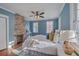 Stylish bedroom with exposed brick, ample natural light, and cozy decor elements at 10 Humphrey Ct, Charleston, SC 29403