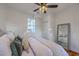 Bedroom with a large bed, a bright window and a full-length mirror on display at 10 Humphrey Ct, Charleston, SC 29403