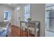 Cozy breakfast nook featuring a small table, two stools, and abundant natural light at 10 Humphrey Ct, Charleston, SC 29403