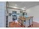 Updated kitchen with stainless steel appliances, white cabinets, and a dining area for four at 10 Humphrey Ct, Charleston, SC 29403
