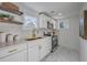Elegant kitchen featuring white cabinets, quartz countertops, gold accents, and stainless steel appliances at 10 Humphrey Ct, Charleston, SC 29403