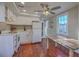 Cozy kitchen with white cabinets, stainless appliances and a table in a well-lit space at 10 Humphrey Ct, Charleston, SC 29403
