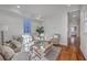 Bright living room featuring a neutral color palette, hardwood floors, and cozy seating area at 10 Humphrey Ct, Charleston, SC 29403