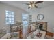 Cozy living room with a decorative fireplace, wood floors, and a view into the modern kitchen at 10 Humphrey Ct, Charleston, SC 29403