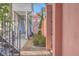 Charming side yard with brick pavers, lush greenery, and glimpses of neighboring homes at 10 Humphrey Ct, Charleston, SC 29403