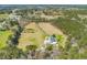 Picturesque estate with pond and mature trees on a large, well-manicured lawn, providing privacy at 1008 Hoodtown Rd, Bonneau, SC 29431