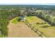 Lush sprawling estate with a long driveway, large pond, and expansive tree-lined property at 1008 Hoodtown Rd, Bonneau, SC 29431