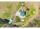 Aerial view of private pool area at estate surrounded by lush landscaping and mature trees at 1008 Hoodtown Rd, Bonneau, SC 29431
