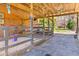 Interior view of barn with horse stall and outdoor access, ideal for equestrian enthusiasts at 1008 Hoodtown Rd, Bonneau, SC 29431